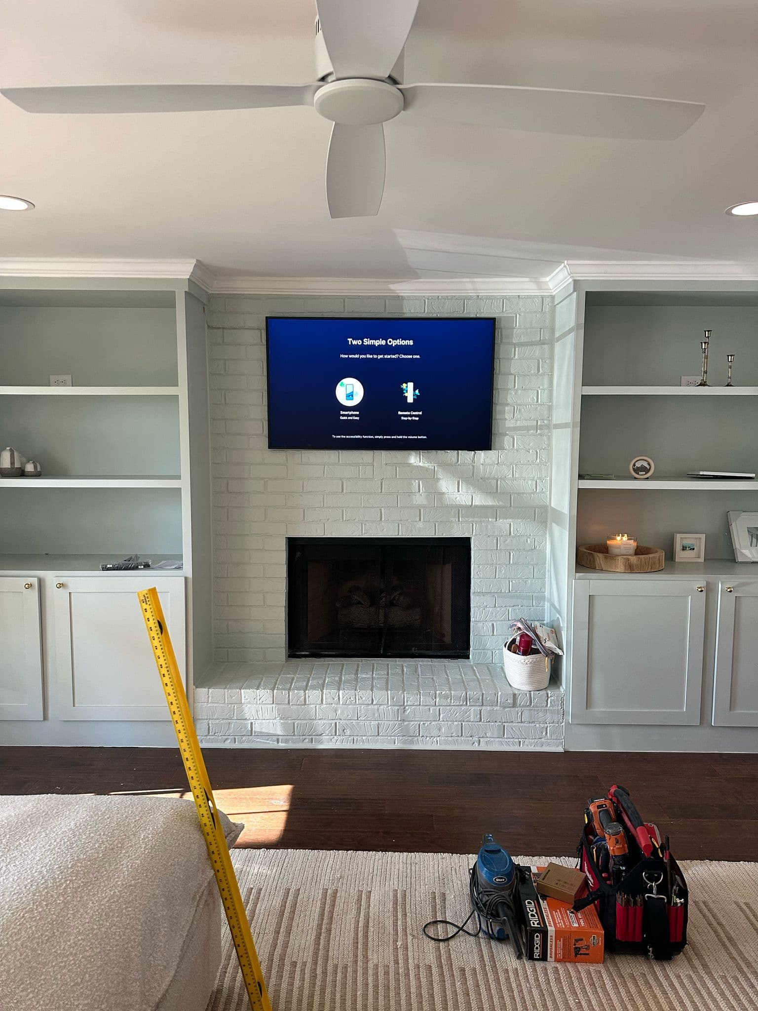 Licensed technician mounting a flat screen TV on a wall in Nashville